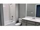 Well-lit bathroom showcases a sleek white tub, toilet, and vanity at 1165 Basalt Ln, Sanford, FL 32771