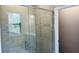 Bathroom with glass shower and tile surround at 1165 Basalt Ln, Sanford, FL 32771