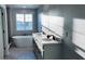 Bright bathroom with double vanity, soaking tub, and stylish fixtures, creating a spa-like atmosphere at 1165 Basalt Ln, Sanford, FL 32771
