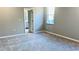 Cozy bedroom with soft carpet and a glimpse of the bathroom at 1165 Basalt Ln, Sanford, FL 32771