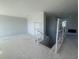A large bonus room or loft with stairs in the construction process with bare walls and ceilings at 1165 Basalt Ln, Sanford, FL 32771