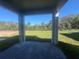 Covered patio with brick flooring provides scenic backyard views at 1165 Basalt Ln, Sanford, FL 32771