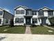 Charming two-story home with a well-manicured lawn and beautiful contrasting trim at 1360 Lumpini St, St Cloud, FL 34771