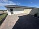 Private brick patio featuring white fencing and a view of the surrounding area at 1360 Lumpini St, St Cloud, FL 34771