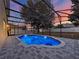 Inviting screened pool with blue water and stone pavers at 2387 Laurel Blossom Cir, Ocoee, FL 34761