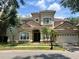 Beautiful two-story home features a two-car garage, elegant entryway, and well-maintained landscaping at 7014 Phillips Cove Ct # 27, Orlando, FL 32819