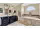 Large bathroom with double sinks, soaking tub and shower at 1007 Tony Cir, St Cloud, FL 34772