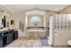 Spa-like bathroom with double vanity, soaking tub and shower at 1007 Tony Cir, St Cloud, FL 34772