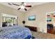 Spacious bedroom with a king-size bed and ensuite bathroom access at 1007 Tony Cir, St Cloud, FL 34772