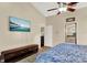 Bright bedroom with a king-size bed and views into the bathroom at 1007 Tony Cir, St Cloud, FL 34772