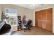 Home office with desk, chair and wood floors at 1007 Tony Cir, Saint Cloud, FL 34772