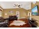 Spacious living room with hardwood floors, brown leather couches, and open concept layout at 1007 Tony Cir, St Cloud, FL 34772
