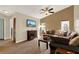 Living room with brown sectional sofa and wood floors at 1007 Tony Cir, St Cloud, FL 34772
