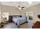 Main bedroom with access to a private screened-in patio at 1007 Tony Cir, St Cloud, FL 34772