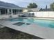 Inviting pool area with patio furniture and spa at 1007 Tony Cir, St Cloud, FL 34772