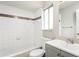 Bright and clean bathroom featuring a white sink and white tiled walls at 5417 Fairwood Way # 304, Orlando, FL 32808