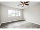 Bedroom featuring ceiling fan and a large, bright window at 5417 Fairwood Way # 304, Orlando, FL 32808