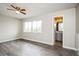 Bright bedroom with a ceiling fan and large windows that bring in natural light at 5417 Fairwood Way # 304, Orlando, FL 32808