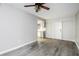 Well-lit living room with a ceiling fan and views of the kitchen at 5417 Fairwood Way # 304, Orlando, FL 32808