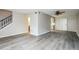 Spacious living room featuring gray wood-look floors at 5417 Fairwood Way # 304, Orlando, FL 32808