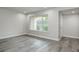 Minimalistic living room with a large window bringing in natural light at 5417 Fairwood Way # 304, Orlando, FL 32808