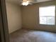 Bright bedroom with ceiling fan and carpeted floors at 474 S Pin Oak Pl # 108, Longwood, FL 32779