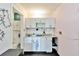 Small kitchen with white cabinets, sink, and appliances at 7900 S Orange Blossom Trl # 2097, Orlando, FL 32809