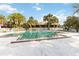 Community pool with surrounding lounge chairs and tropical landscaping at 7900 S Orange Blossom Trl # 2097, Orlando, FL 32809