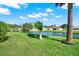 Beautiful backyard with pond view and lush lawn at 103 Old Sunbeam Dr, South Daytona, FL 32119