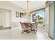 Casual breakfast nook with table and chairs, near a window at 103 Old Sunbeam Dr, South Daytona, FL 32119