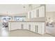 White kitchen with gray countertops and ample cabinet space at 103 Old Sunbeam Dr, South Daytona, FL 32119