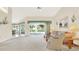 Spacious living area with access to a patio and view of canal at 103 Old Sunbeam Dr, South Daytona, FL 32119