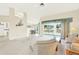 Open living room, dining area, and kitchen at 103 Old Sunbeam Dr, South Daytona, FL 32119