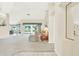 Bright living room with vaulted ceilings and access to a patio at 103 Old Sunbeam Dr, South Daytona, FL 32119