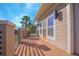 Relaxing balcony with stylish railings, a wooden floor, and a view of lush landscaping at 14046 Walcott Ave, Orlando, FL 32827