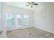 Inviting room with neutral carpet, ample natural light, and a door leading to a balcony at 14046 Walcott Ave, Orlando, FL 32827