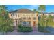 Beautifully landscaped two-story home with an orange front door and well-maintained lawn at 14046 Walcott Ave, Orlando, FL 32827