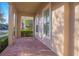 Inviting front porch featuring brick flooring, neutral colors, and beautiful curb appeal at 14046 Walcott Ave, Orlando, FL 32827