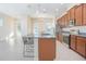 Bright kitchen with granite countertops, stainless steel appliances, and an island with bar seating at 14046 Walcott Ave, Orlando, FL 32827
