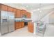 Spacious kitchen featuring stainless steel appliances, granite countertops, and a center island at 14046 Walcott Ave, Orlando, FL 32827