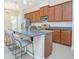 Beautiful Kitchen with granite countertops, stainless steel appliances, and an island with bar seating at 14046 Walcott Ave, Orlando, FL 32827