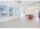 Bright and airy living room with large windows and tile flooring, adjacent to the kitchen at 14046 Walcott Ave, Orlando, FL 32827