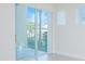 Bright room with glass sliding doors leading to a patio, alongside windows with blinds at 14046 Walcott Ave, Orlando, FL 32827