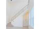 Modern staircase with metal railings and large windows offering natural light at 14046 Walcott Ave, Orlando, FL 32827
