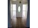 Inviting entryway with tiled floor and glass-paned door at 1575 Guinevere Dr, Casselberry, FL 32707