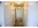 Clean hallway with light walls and tiled flooring at 1575 Guinevere Dr, Casselberry, FL 32707