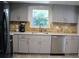 Modern kitchen featuring gray cabinets and quartz countertops at 1575 Guinevere Dr, Casselberry, FL 32707