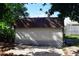 Outdoor storage shed with a brown roof and white siding at 1575 Guinevere Dr, Casselberry, FL 32707