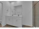 Double vanity bathroom with a large mirror and shower at 434 Belmond Dr, Debary, FL 32713