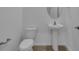Simple bathroom with pedestal sink and toilet at 434 Belmond Dr, Debary, FL 32713